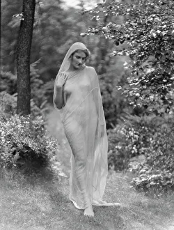 Egger, Gabrielle, Miss, standing outdoors, between 1926 and 1930. Creator: Arnold Genthe