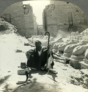 Reptiles Prints: An Egyptian Snake Charmer Piles His Trade Beside the Avenue of Sphinxes, Temple of Karnak