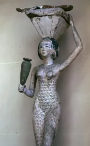 Egyptian statuette of a woman bearing offerings, 22nd century BC