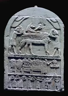 Anubis Collection: Egyptian stele showing Anubis preparing a mummy