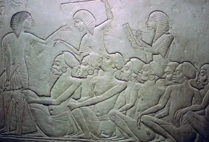 Overseer Prints: Detail of an Egyptian stele showing an overseer, slaves and scribe