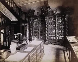 Cabinet Prints: An eighteenth-century apothecary's shop with intricately carved wooden showcases; recreated