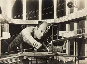 Silver Gelatin Photography Collection: El Lissitzky Working on a Stage Design, Meyerhold Theatre, 1929. Creator: Anonymous