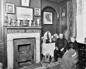 Aged Prints: Elderly couple in Victorian interior, Albury Street, Deptford, London, 1911