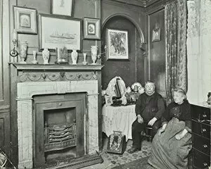 Deptford Gallery: Elderly couple in Victorian interior, Albury Street, Deptford, London, 1911