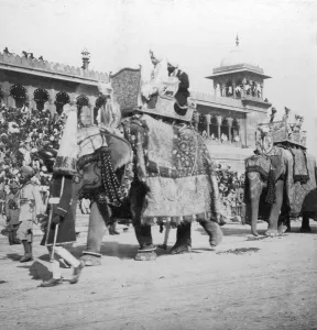 H Hands Son Prints: An elephant procession passing Jumma Masjid, Delhi, India, 1900s. Artist: H Hands & Son