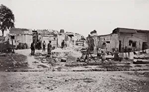Brady Collection: [Encampment with shacks and laundry]. Brady album, p. 129, 1861-65. Creator: Unknown
