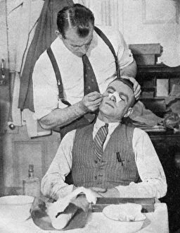 Arsenal Football Club Collection: England captain Eddie Hapgood receives treatment for a broken nose after a match with Italy, 1934