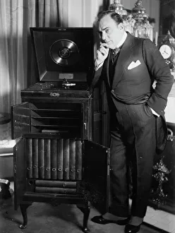 Phonograph Prints: Enrico Caruso with phonograph, between 1918 and c1920. Creator: Bain News Service