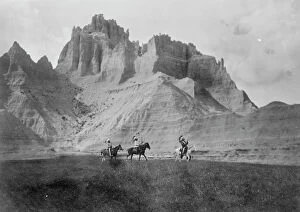 Journey Collection: Entering the Bad Lands. Three Sioux Indians on horseback, c1905. Creator: Edward Sheriff Curtis