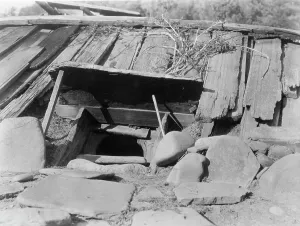 Yurok Prints: Entrance to a Yurok Sweat-house, c1923. Creator: Edward Sheriff Curtis