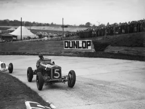 Maserati Prints: ERA and Maserati taking a corner in a race at Brooklands. Artist: Bill Brunell