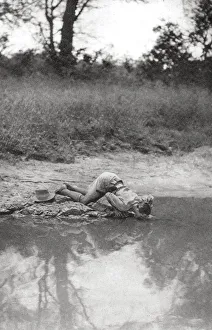 Thirsty Prints: Errol Hinds drinking, Mongalla to Terrakekka, Sudan, 1925 (1927). Artist: Thomas A Glover