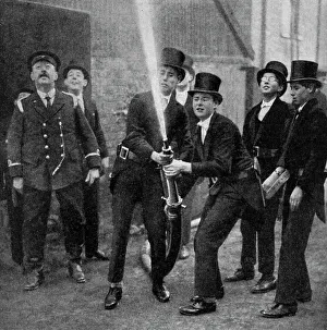 Images Dated 4th December 2009: Etons amateur firemen practising a hose drill, Berkshire, c1922