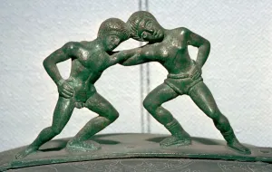 Etruscan bronze handle of a cista, showing Peleus and Thetis wrestling