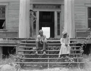 Enslaved People Prints: Ex-slave and wife on steps of plantation house now in decay