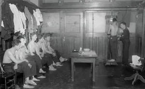 Weighing Prints: Examining naval volunteers, between c1915 and c1920. Creator: Bain News Service