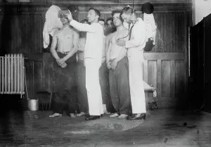 Examining Prints: Examining new Navy Recruits, between c1910 and c1915. Creator: Bain News Service
