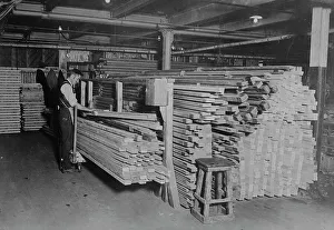 Spruce Prints: Examining spruce for planes, between c1915 and c1920. Creator: Bain News Service