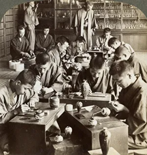 Cloisonne Prints: Expert workmen creating designs in cloisonne