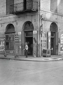Corner Shop Prints: Exterior of Court House Grocer, New Orleans, between 1920 and 1926. Creator: Arnold Genthe