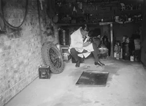 Spare Wheel Prints: FA Thatcher in his garage. Artist: Bill Brunell