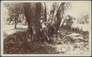 Ammunition Prints: F.A. Williams resting against a tree, 1892. Creator: Unknown