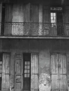 Balcony Rail Prints: Facade of a building with shuttered doors and balcony