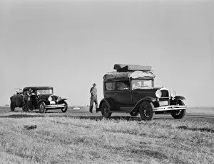 Internally Displaced Persons Gallery: Two families originating from Independence, Kansas, US99, between Tulare and Fresno, 1939