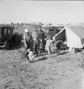 Part of family arrived the night before... near Holtville, Imperial Valley, CA, 1939. Creator: Dorothea Lange