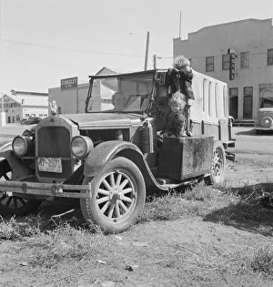 Family, one month from South Dakota, now on the road... Tulelake, Siskiyou County, California, 1939 Creator: Dorothea Lange