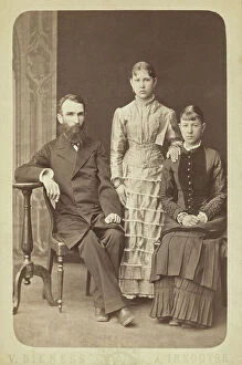 Sisters Collection: Family portrait of an unidentified man and his two daughters, 1885. Creator: Unknown