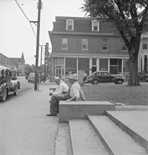 Staircase Gallery: Farmers idling around the courthouse, Roxboro, North Carolina, 1939. Creator: Dorothea Lange