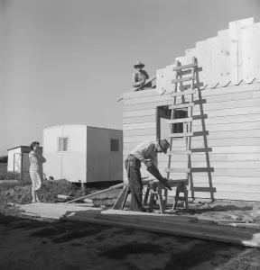 Displaced Persons Collection: Father and son building house on outskirts of Salinas, California, 1939. Creator: Dorothea Lange