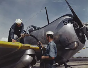 Sailors Collection: Feeding an SNC advanced training plane its essential supply of gas...Corpus Christi, Texas, 1942
