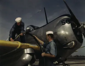 Feeding an SNC advanced training plane its essential supply of gas... Corpus Christi, Texas, 1942. Creator: Howard Hollem