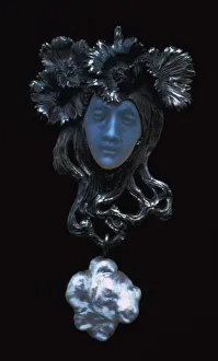 Extravagant Prints: Female face pendant, c1898-1900. Artist: Rene Lalique
