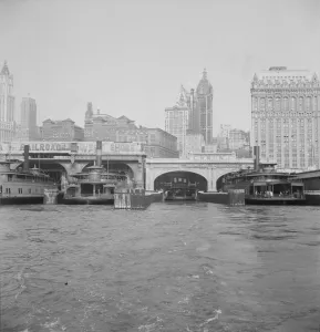 Ferry boats still make train connections which transports passengers in... of New York City, 1939. Creator: Dorothea Lange