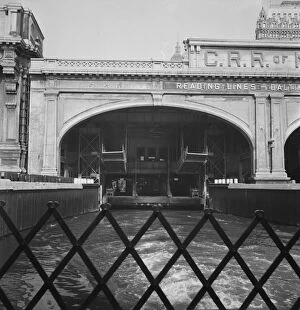 Train Station Gallery: Ferry slip seen from ferry which transports passengers across the Hudson... New York City, 1939