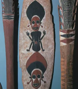 Canoe Prints: Detail of figures carved and painted on a ceremonial canoe paddle from the Solomon Islands