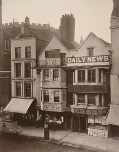 Figures standing near a shop front on Macclesfield Street, Soho, London, 1883. Artist