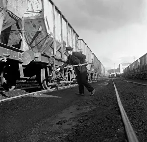 Final adjustments to a rail truck hauling coal from Lynemouth Colliery, Northumberland, 1963