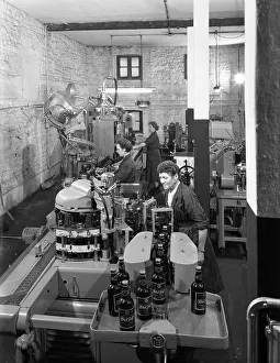 The final stages of bottling whisky at Wiley & Co, Sheffield, South Yorkshire, 1960