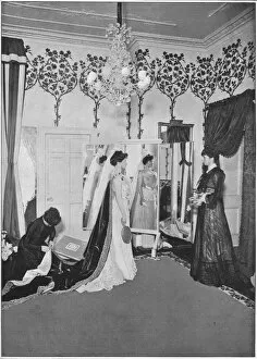 Dressmaking Gallery: The finishing touches of a dressmaker, London, c1901 (1901)