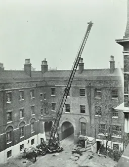 Firefighting Prints: Firemen demonstrating the magirus ladder, London Fire Brigade Headquarters, London, 1910