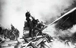 Extinguishing Prints: Firemen fighting a fire at a timber yard, London, 1926-1927