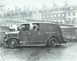 Firefighting Prints: Firemen inside a fire engine, Kingsland Road Fire Station, London, 1935