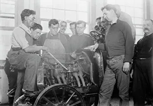 Learning Prints: Firemen studying auto motor, between c1910 and c1915. Creator: Bain News Service
