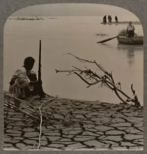 Fishermen by the Dead Sea: showing cracks on shore, c1900