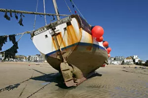 Father's Day Collection: Fishing boat in the harbour at low tide, St Ives, Cornwall